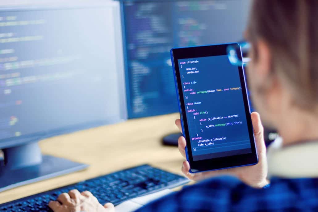 Liventus Web Application Development Man Examining Code