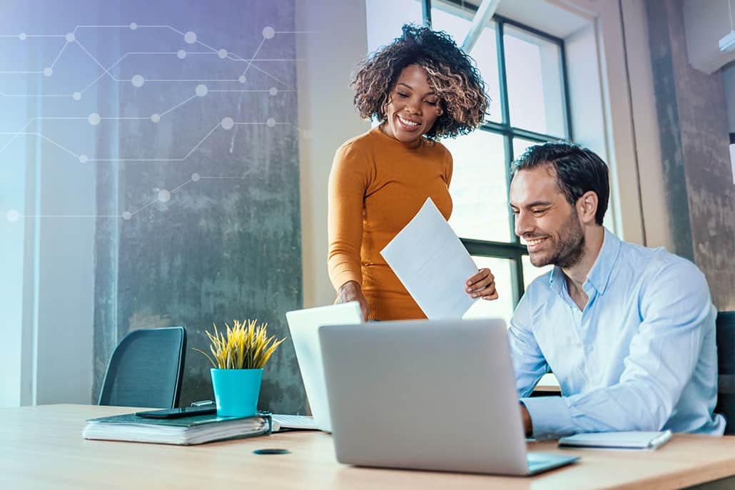 Two business owners check the status of their development work.