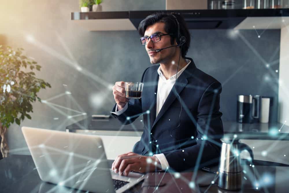Businessman works from remote at house with a laptop