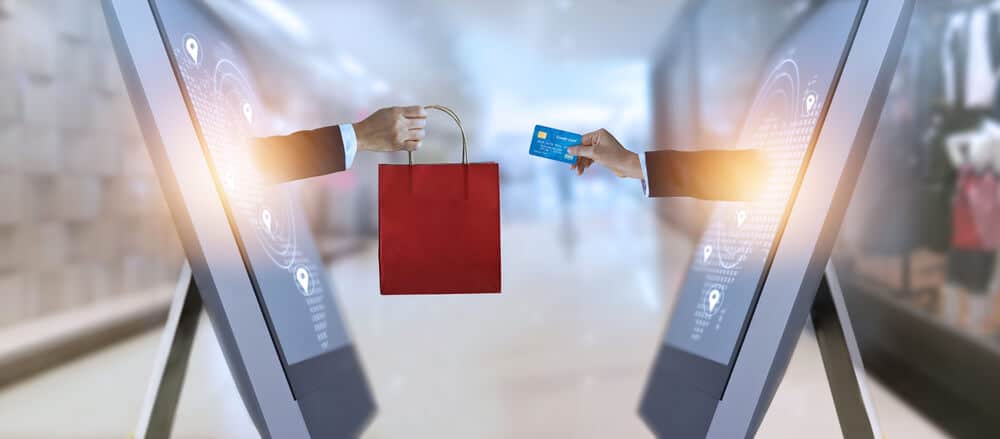 e-commerce, hand holding shopping bag and credit card