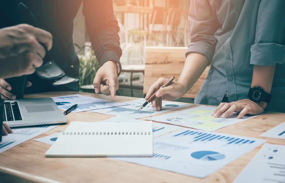 start-up analysis to data paper chart on desk