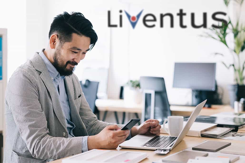 Man sitting in front of laptop at the Liventus office