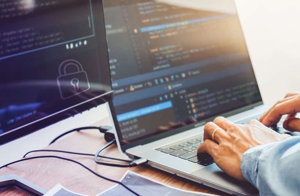 a person coding on the workstation