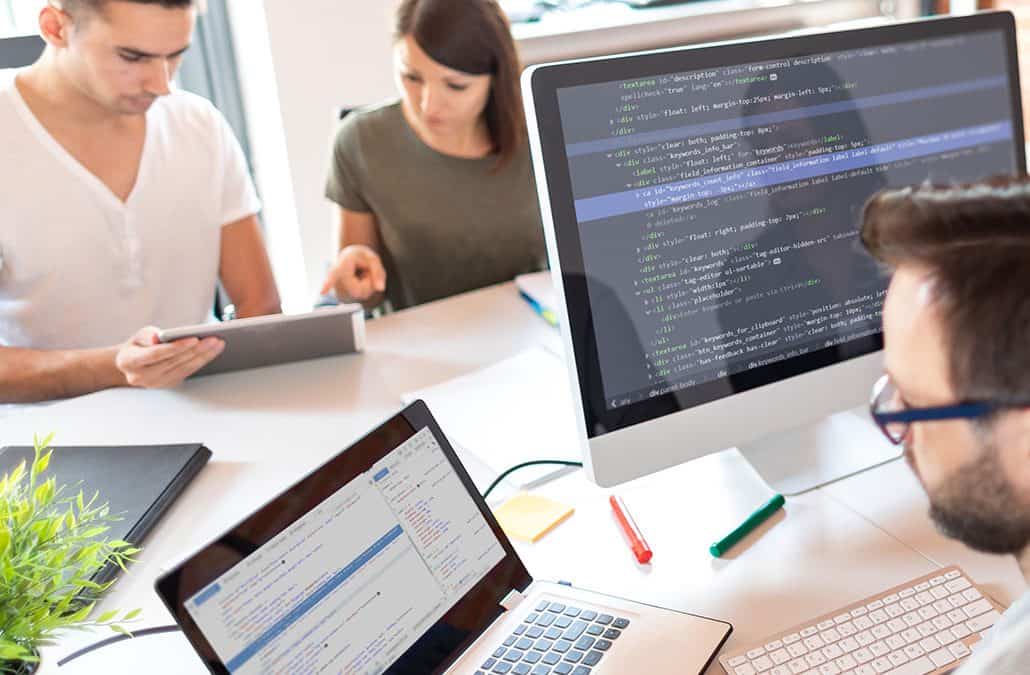 three people working in the office