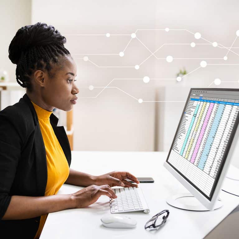 A girl working on the desktop machine
