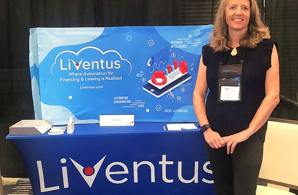Danielle standing in front of Liventus Booth