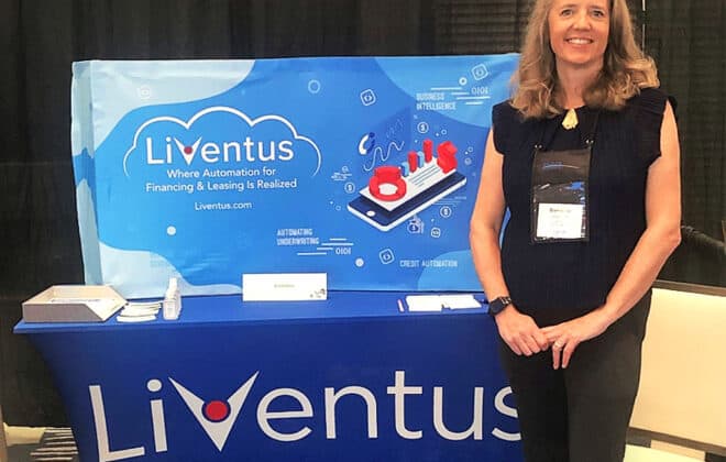 Danielle standing in front of Liventus Booth