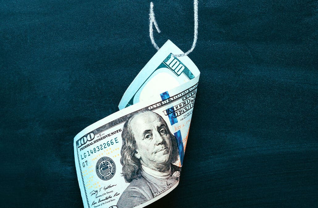 dollar bill stuck on a fishing hook