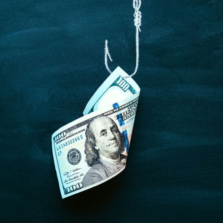 dollar bill stuck on a fishing hook